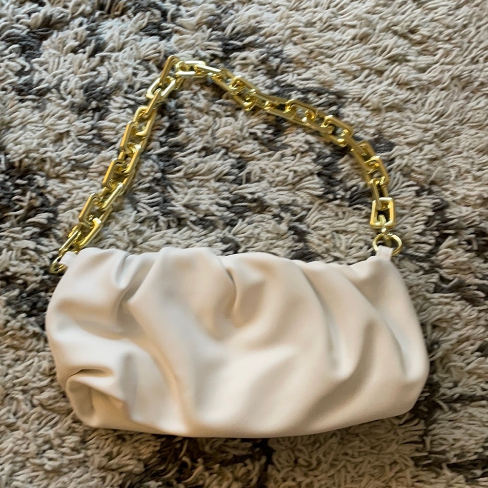 White dumpling bag with gold chain